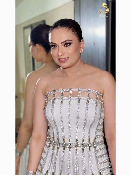 A modern and edgy bubble braid, perfect for a high-fashion look. The sleek base and defined "bubbles" create a strong, graphic silhouette.