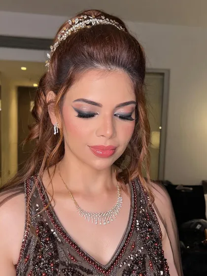 A beautiful portrait showing the completed look. The sparkling tiara adds a touch of royalty to this glamorous style.