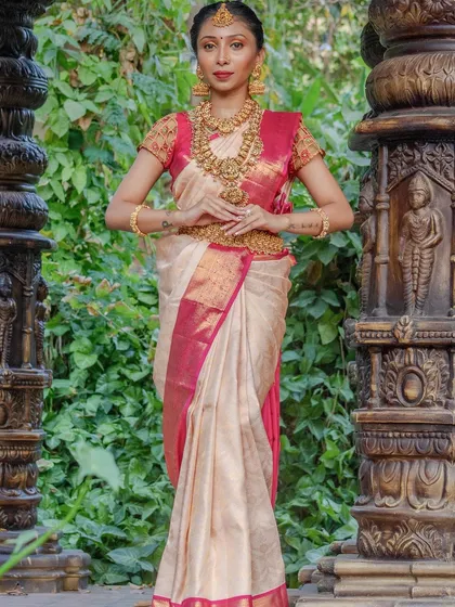 A full-length shot showcasing how our complete bridal set, including the vaddanam (waist belt), creates a cohesive and regal look for a South Indian bride.