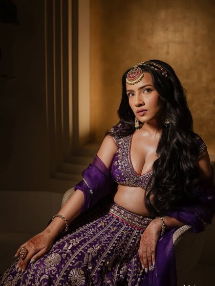 A seated portrait of Shubhangi, looking every bit the princess on her Sangeet night.