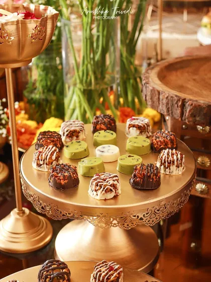 Another view of the festive chocolate display, showing the treats in the context of a larger party spread. This helps potential clients visualize how their event could look.