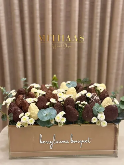 Why gift an ordinary bouquet when you can give a "berrylicious" one? This edible masterpiece is bursting with fresh strawberries dipped in white and dark chocolate, nestled among delicate flowers.