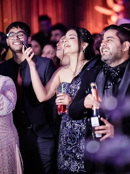 The joy of celebrating with friends and family, all cheering and enjoying the moment.