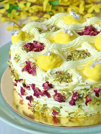 A delicious Rasmalai Pista cake, showcasing a popular Indian dessert fusion. The image highlights the creamy texture and rich toppings, making it irresistible for cake lovers.