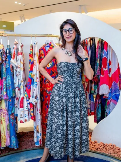 Your wardrobe tells a story about you. In this photo, I'm wearing a strapless printed dress that feels both playful and chic, showcasing how your clothes can reflect your personality.