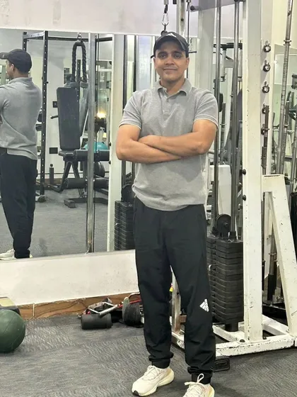 My reflection in the mirror shows my focus. I bring this same level of dedication to every client's training.