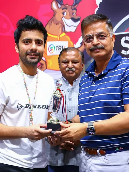 Receiving the winner's trophy for the Men's Open at the 1st TSH Squash Open in Kanpur.