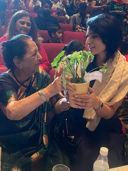 Receiving a plant as a token of gratitude. It symbolizes the growth we aim to nurture in every child.
