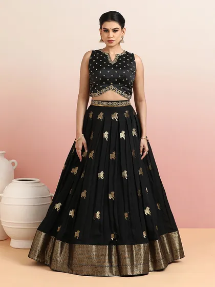 The full view of the black Pichwai lehenga, a sophisticated and unique choice for weddings and festive soirées.