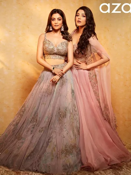 A powerful pose from the Aza Fashions sister shoot. The voluminous, side-parted waves add a touch of drama and sophistication to Kajal's overall look.