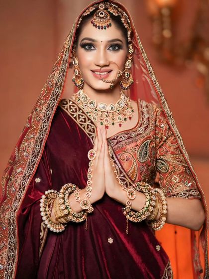 Another beautiful portrait of this royal bride, her hands joined in a traditional greeting.