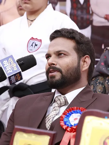 As a coach, I am dedicated to promoting the discipline of martial arts in the community. Here I am during a live interview at a Shotokan Karate belt grading event we organized.