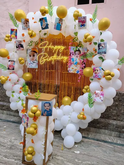 A close-up of the personalized birthday balloon ring with photos.