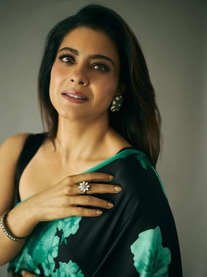 This shot highlights the beautiful floral ring and bracelet that add a touch of sparkle to the ensemble.