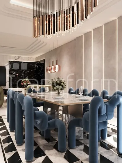 This dining space is a study in playful elegance. The sculptural blue velvet chairs are the focal point, creating a dialogue with the geometric flooring and the cascading chandelier. It's a space designed for conversation and artful living.