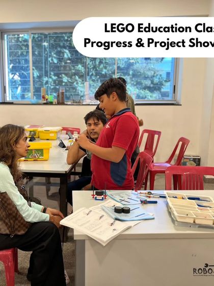 A student at Vidyashilp Academy explains her LEGO creation to her mother during our project showcase. These presentations help build confidence and communication skills.