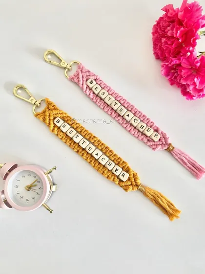 A special handmade gift for the teachers who guide us. These "Best Teacher" macrame keychains are a thoughtful way to show appreciation, customized with letter beads and available in different colors.