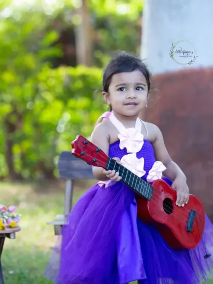 A little rockstar in the making. Using props like a toy guitar, I can create a fun, music-themed photoshoot that lets your child's personality shine.