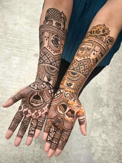A customized bridal design featuring an elephant on one arm and a tiger on the other, reflecting the bride's personality and story.