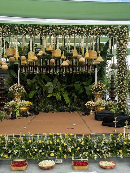A full frontal view of the stage with the hanging yellow floral bells.