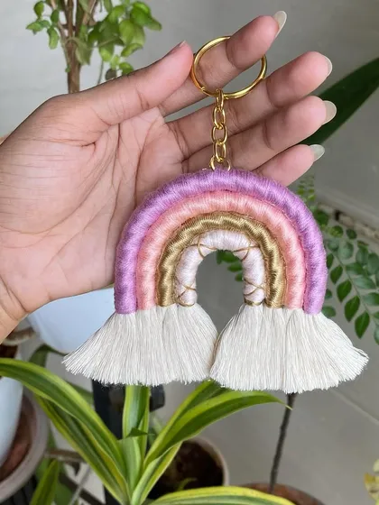 This version of our macrame rainbow keychain features lovely shades of purple and pink. All our keychains are made with durable cord and high-quality hardware.