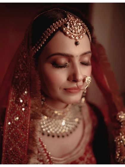 A close-up portrait of Vaishali, her eyes closed, her expression one of pure contentment.