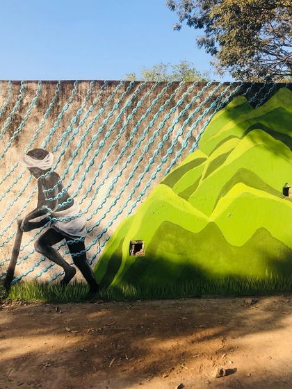 Each panel of the 'Stories of Water' mural tells a different part of the story. From the farmer dependent on the rains to the children playing in floodwaters, the artwork depicts the complex and often contradictory realities of water access and urbanization in our city.