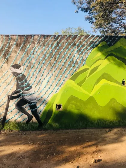 Each panel of the 'Stories of Water' mural tells a different part of the story. From the farmer dependent on the rains to the children playing in floodwaters, the artwork depicts the complex and often contradictory realities of water access and urbanization in our city.