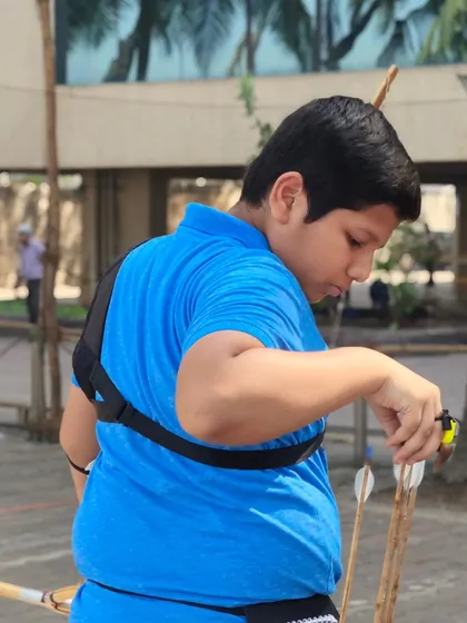 An archer preparing his equipment. We teach our students to be responsible and meticulous with their gear.