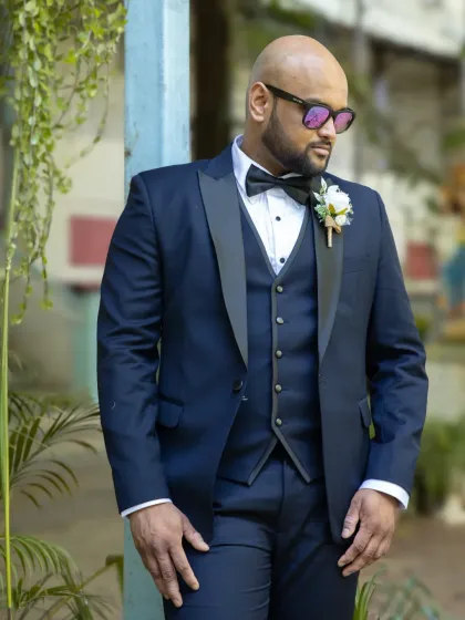 A stylish groom portrait. The lighting and pose give this shot a cool, confident vibe, perfect for the modern groom.