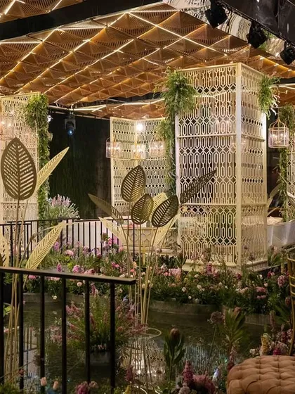 For this Mehendi sundowner, we built a custom floating island in a lotus pond, complete with intricate macrame structures and an illuminated ceiling. The entire space transformed as the sun set, creating a magical alfresco experience that was all heart.