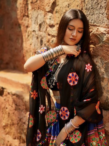 A close-up on the silver jewelry, including the chunky bracelets and rings that complete this Navratri look.