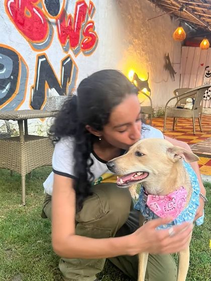 A sweet kiss for the birthday girl. These candid moments of love and affection are what make parties at Bow Bow's Den so special.