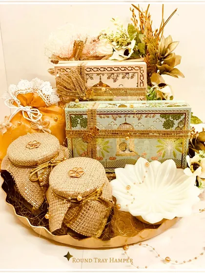 We craft golden moments for your most cherished occasions. Our round tray wedding hamper, adorned with intricate details and filled with premium selections, is the epitome of regal elegance for wedding gifting.