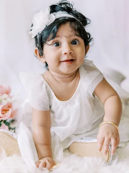 A close-up of the six-month-old's bright, curious eyes. She is absolutely captivating.