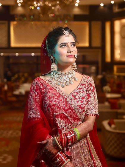 My bride Juhi looking elegant and poised. The professional lighting in this shot highlights the flawless finish of her HD makeup.
