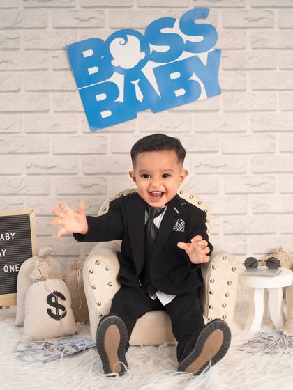 With hands wide open, this little boss is ready for a hug. I love capturing the big, expressive personalities of one-year-olds.