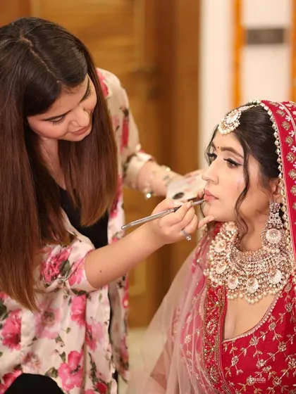 A behind-the-scenes shot of me applying the final touches. I love collaborating with my brides to create their perfect look.