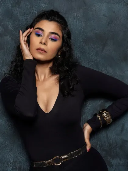 A powerful portrait where the vibrant eye makeup is the undeniable star of the show.