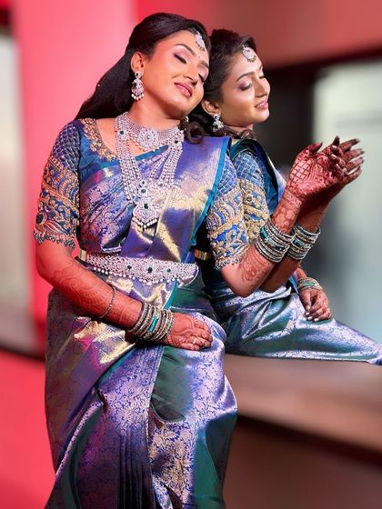 A beautiful portrait of our bride Amulya for her reception. She is wearing a magnificent multi-layered diamond-look CZ necklace set with emerald accents, creating a look of pure glamour.