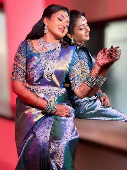 A beautiful portrait of our bride Amulya for her reception. She is wearing a magnificent multi-layered diamond-look CZ necklace set with emerald accents, creating a look of pure glamour.