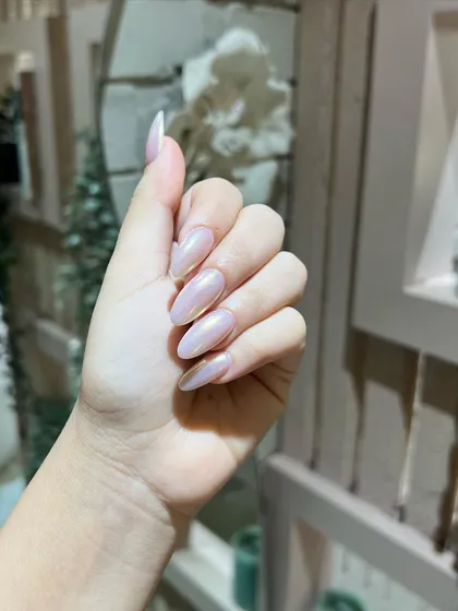 Another shot of the stunning glazed chrome nails, showing off their beautiful sheen and elegant almond shape.