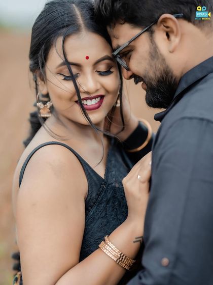 An intimate couple shot. The makeup is designed to look beautiful up close, with a focus on flawless skin and soft, blended tones.