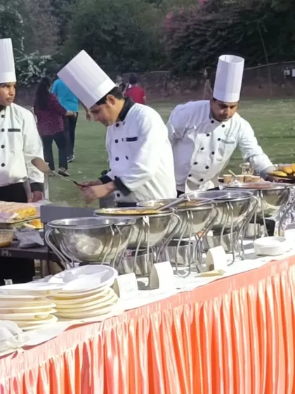 A closer look at our chefs preparing food for an outdoor buffet. Using fresh ingredients and professional equipment, we ensure every dish is cooked to perfection.