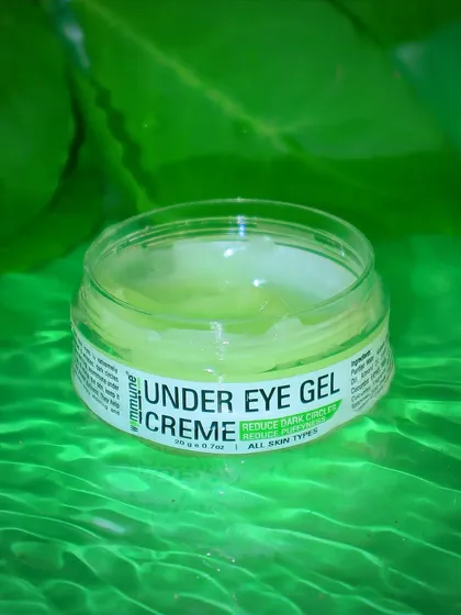 The texture of this Wommune under-eye gel is the hero of this shot. The vibrant green background and ripples of water suggest coolness, hydration, and refreshment.