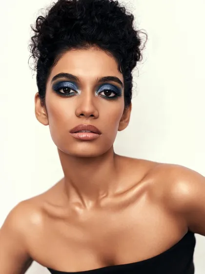 A bold, metallic blue smokey eye for a beauty editorial shoot. This demonstrates my creative range, crafting vibrant and artistic looks that make a statement while maintaining a flawless skin finish.
