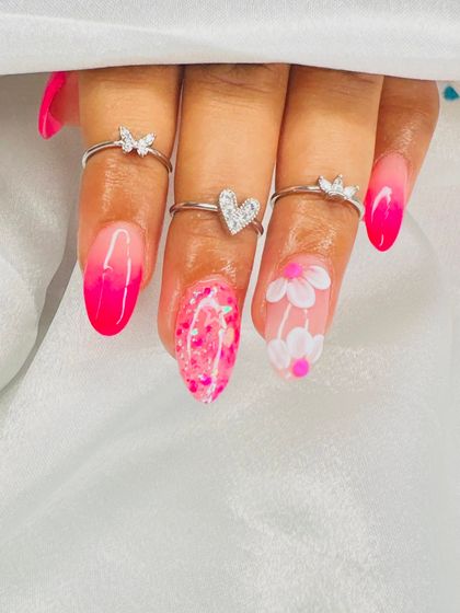 Another detailed shot of the pink ombre and floral nail art, showing the quality and precision taught in our classes.