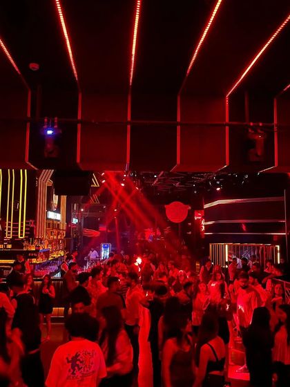 The view of the packed dance floor at Soho Delhi. The club's red lighting system creates an intense and energetic atmosphere.