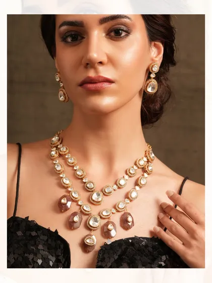 A layered necklace featuring uncut polki diamonds and unique-shaped stones, creating a contemporary yet timeless appeal.