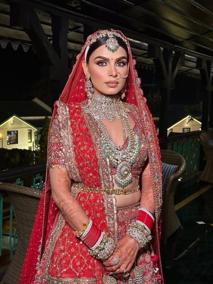 A vision in red, embodying the essence of a modern day queen. This full-length shot shows how the makeup stands out, even with such a grand and opulent outfit.